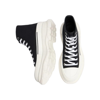 Planet Luxury Brands siyah beyaz kanvas deri yüksek bilekli McQueen sneaker, kalın kauçuk tabanlı bağcıklı tasarım