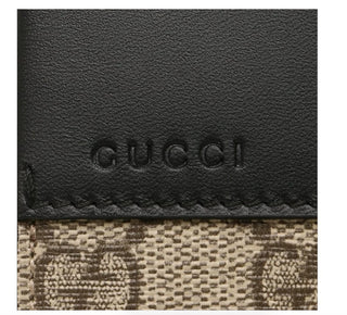 Planet Luxury Brands Gucci deri detaylı kanvas cüzdan üzerinde kabartma logo detayı