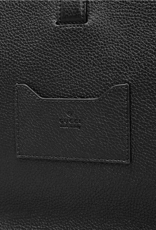 Planet Luxury Brands Gucci siyah deri evrak çantası üzerinde kabartmalı logo detayı