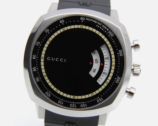 Planet Luxury Brands Gucci siyah kadranlı, paslanmaz çelik kasalı, döner disk göstergeli ve kauçuk kordonlu kol saati