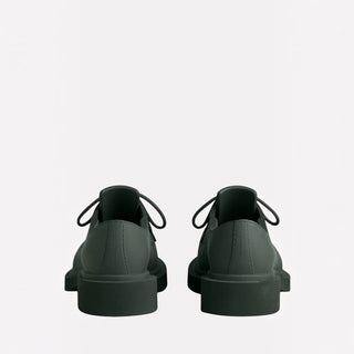Planet Luxury Brands imzalı, haki renkli, deri Balenciaga Steroid erkek loafer ayakkabıların arka görünümü.
