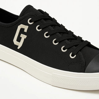 Planet Luxury Brands siyah kanvas Givenchy spor ayakkabı, yan kısımda beyaz G logosu ve beyaz taban detaylı